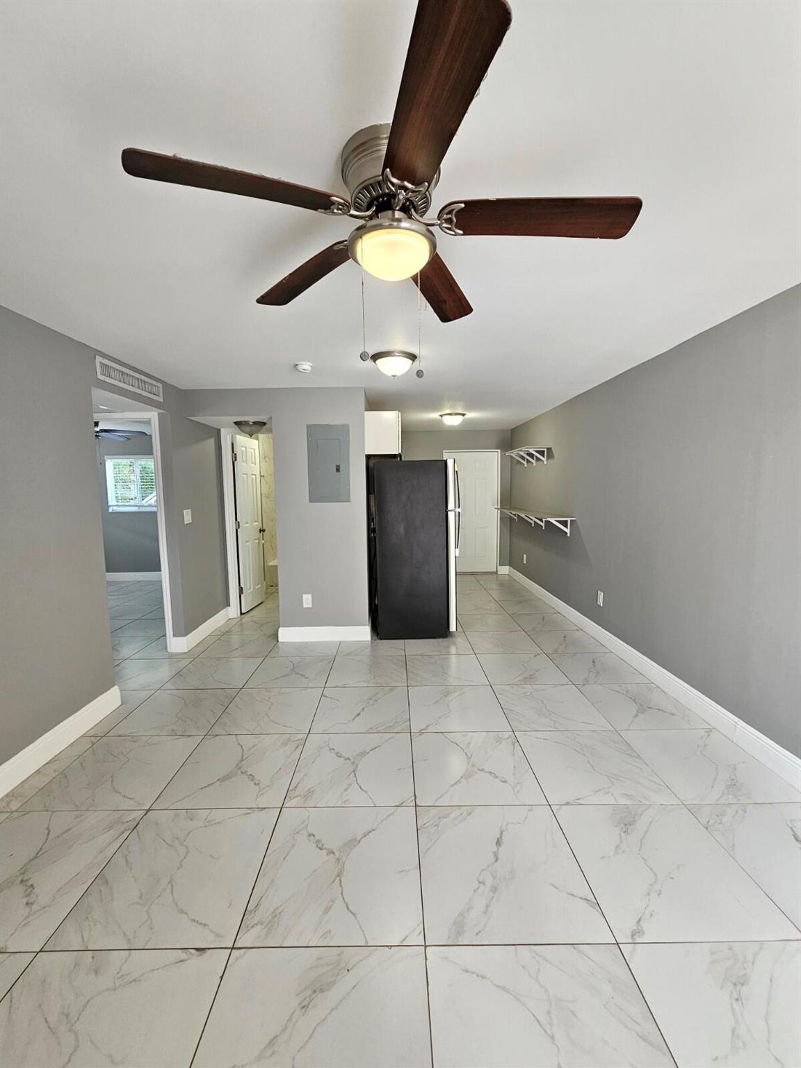 Fully Renovated 2 Bedroom, 1 Bathroom First-Floor Corner Unit in Riviera Beach! This bright and spacious unit features new stainless steel appliances (only 1 year old), granite countertops, and decorative ceramic tile throughout. Enjoy abundant natural light and the convenience of 2 assigned parking spaces right in front of the unit. Washer and dryer in the unit and water is included in rent. Don't miss this incredible opportunity--move-in ready and won't last long!