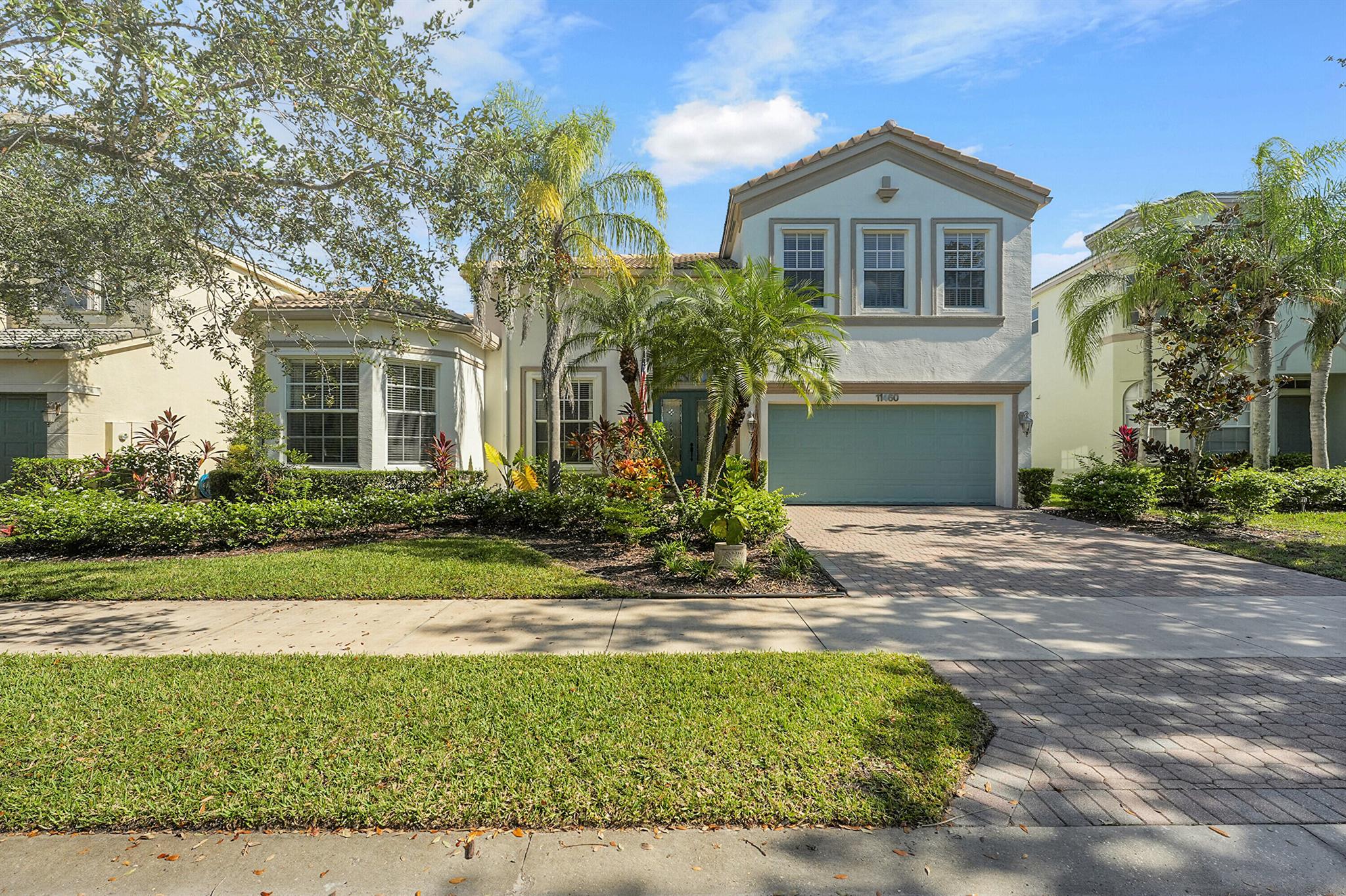 Beautiful 4BR, 3.5BA home in gated Town Park at Tradition with a spacious 19' x 19' bonus room--ideal as a 5th bedroom or recreation space. The grand foyer opens to a great room with coffered ceilings, crown molding, and a screened lanai overlooking preserve views. Gourmet kitchen features stainless steel appliances and double ovens, flowing into the family room. The luxurious primary suite offers dual walk-in closets, double vanities, tiled shower, and soaking tub. Community amenities include pool, clubhouse, tennis, pickleball, gym, and billiards. Recent upgrades: new AC (2025), 2024 water heater, exterior paint, patio, kitchen paint, custom bookcase, trim, roof cleaned, and backyard palms.