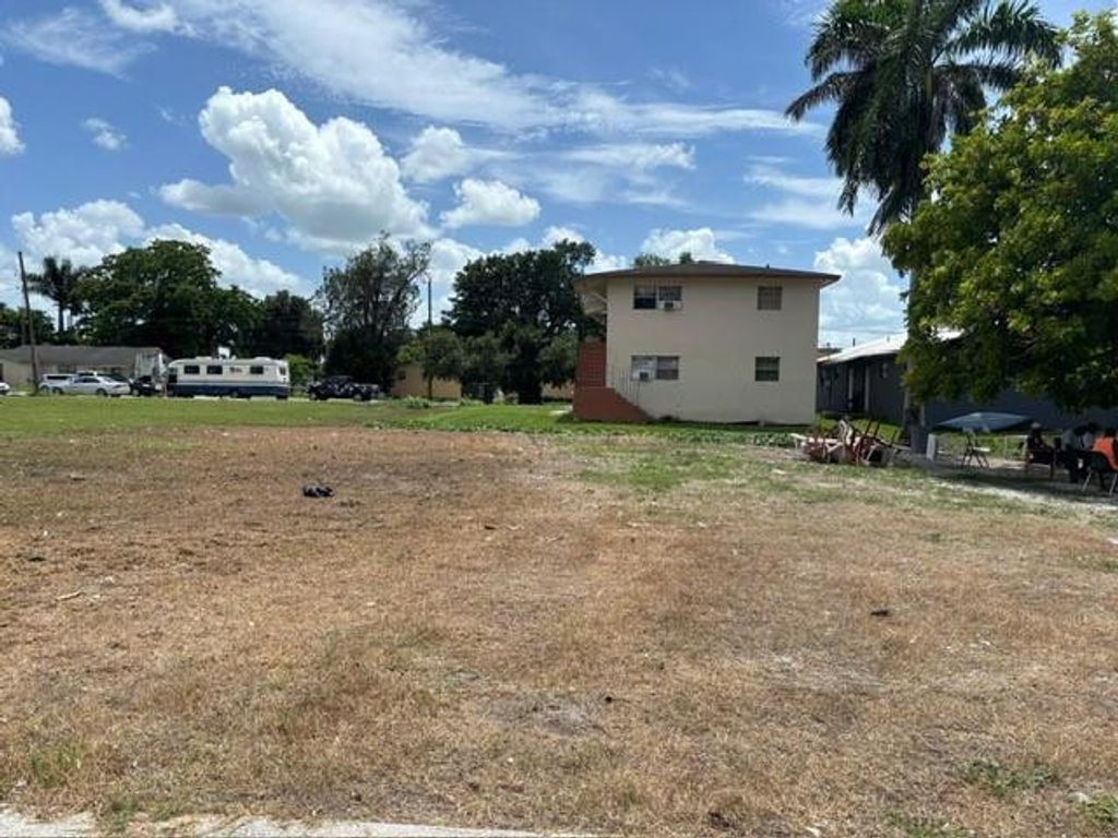 Photo of 724 SW Avenue B Avenue, Belle Glade, FL 33430 (MLS # F10536870)