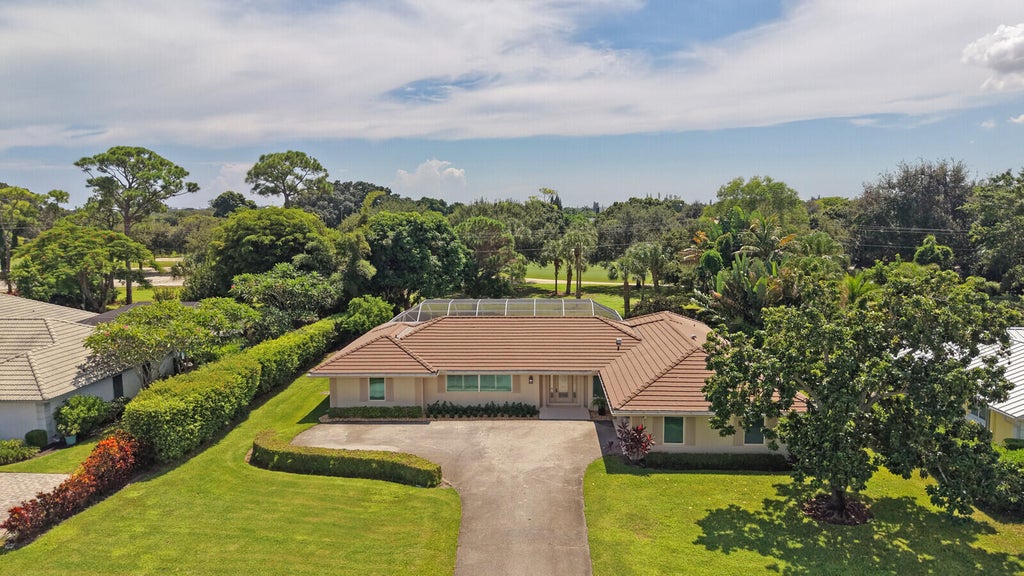 Photo of 408 S Country Club Drive, Atlantis, FL 33462 (MLS # B26077509)