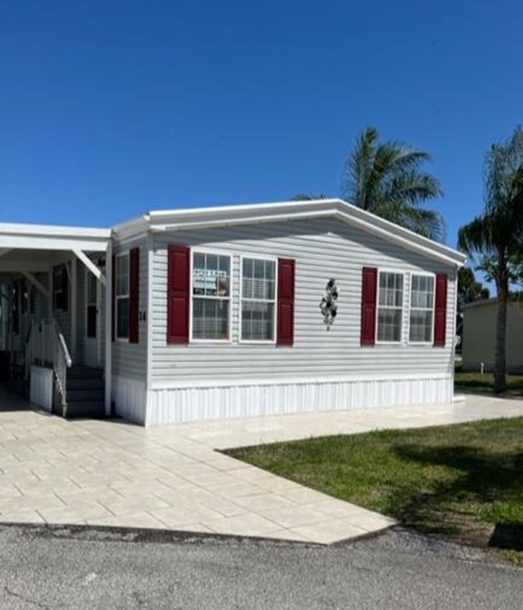 Photo of 14 Andalusia Lane Ln, Port St Lucie, FL 34952 (MLS # R10785617)