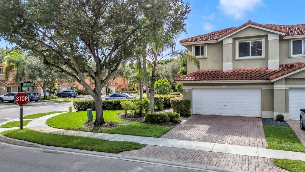Photo of 12502 NW 56th St #12502, Coral Springs, FL 33076 (MLS # F10500908)