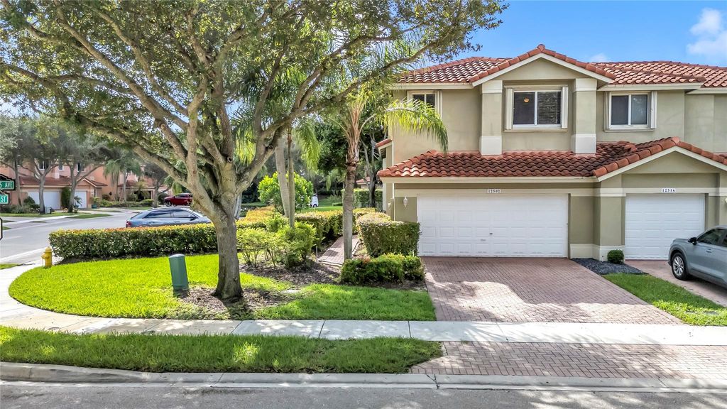 Photo of 12502 NW 56th St #12502, Coral Springs, FL 33076 (MLS # F10500908)