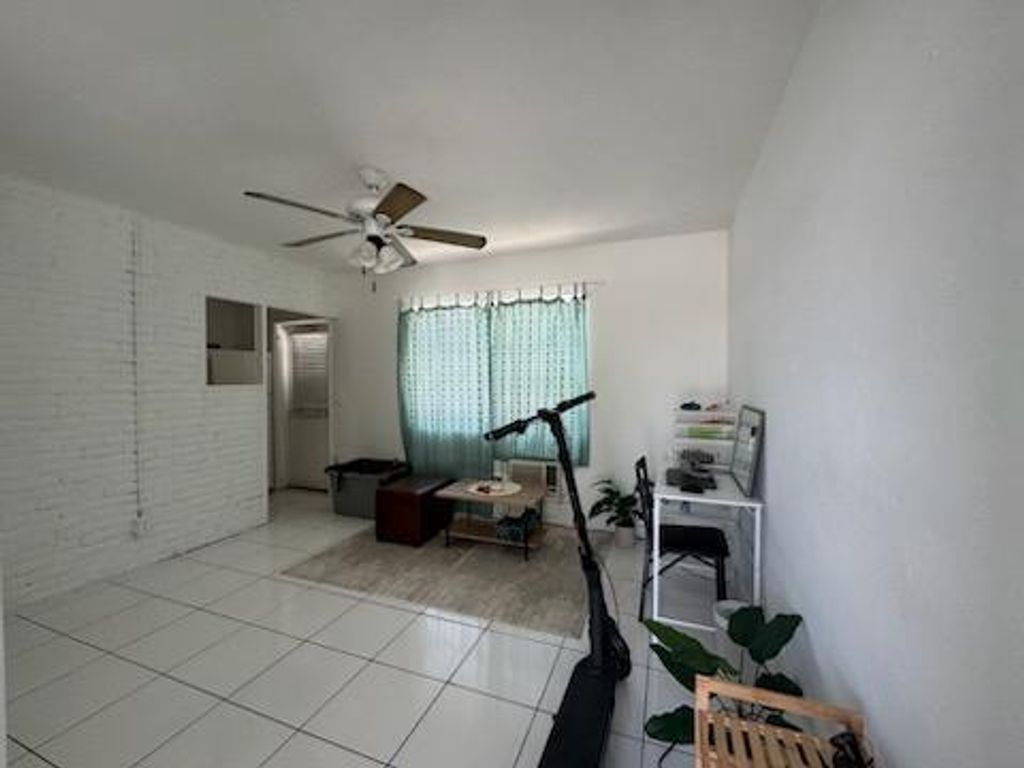 Photo of 1141 E Blue Heron Boulevard #5, Riviera Beach, FL 33404 (MLS # R11121436)