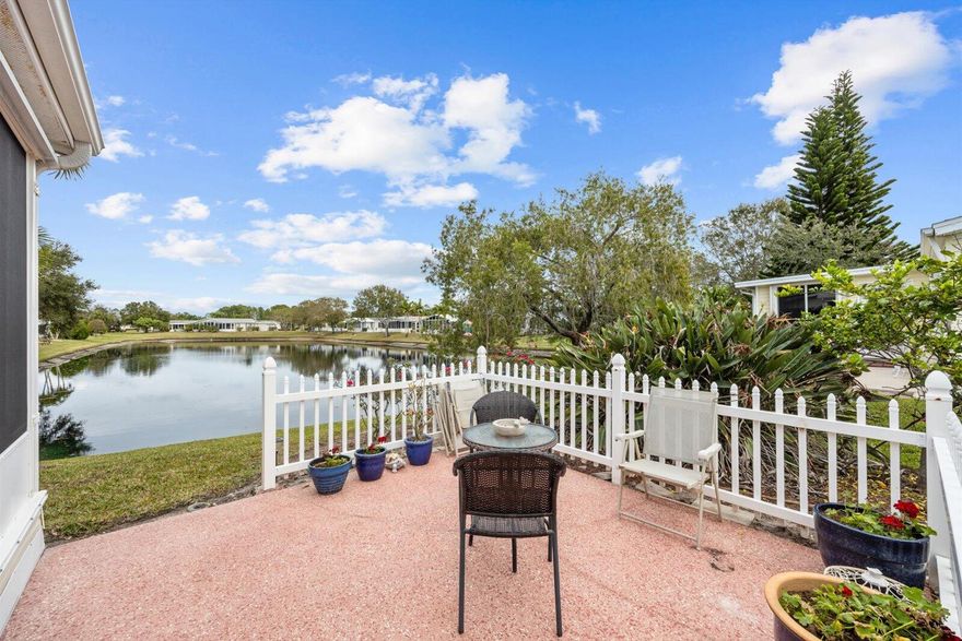 Welcome to Savanna Club, a sought-after 55+ amenity-packed community where resort-style living meets everyday comfort. This popular Coral Reef floor plan offers 2 BR's, 2 BA's, plus a versatile den perfect for an office, hobby room, or guests. Enjoy serene lake views from the 27' enclosed glass porch with its own mini-split A/C, ideal for year-round relaxation. The home is fully furnished turnkey—just bring your suitcase. Features include acc. shutters, 2015 roof, 2023 A/C, cost-saving irrigation well, and laminate and tile flooring thru-out. Start your mornings on the open patio with sunrise views and coffee in hand or take a short walk to Savanna Club's pools, clubhouse, fitness center, golf, activities, restaurant and more! Land Lease Property