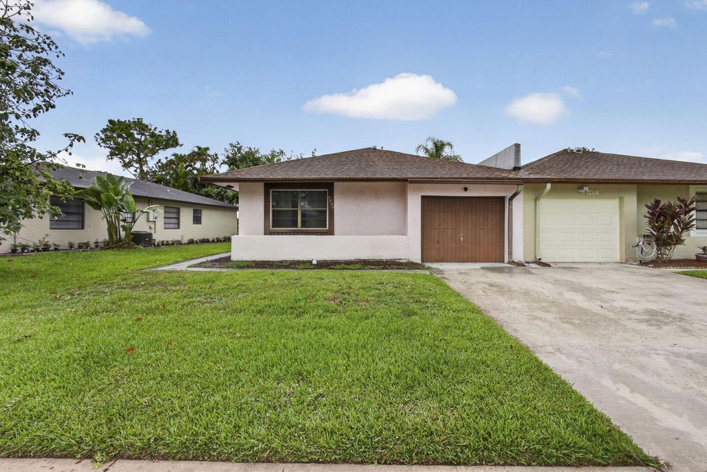 Photo of 4893 Palm Hill Drive, West Palm Beach, FL 33415 (MLS # B26038764)