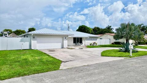 Photo of 1861 Caribbean Road W, Lake Clarke Shores, FL 33406 (MLS # R11128714)