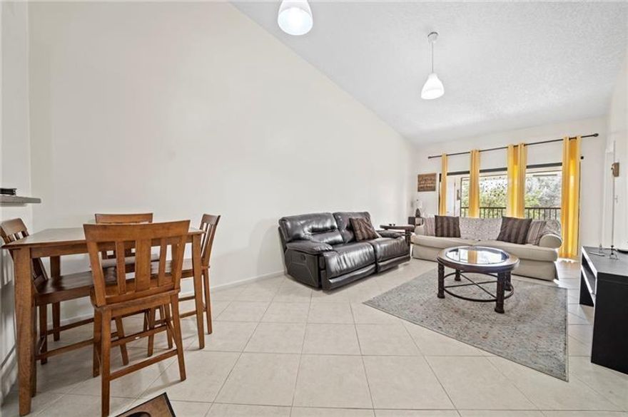 Beautiful 2 bed 2 bath condo in tranquil Mira Lago Gated Community, located in Oakland Park! This completely remodeled open concept unit features vaulted ceilings, spacious Kitchen and breakfast nook with ample pantry space, storage, marble counters, backsplash, updated cabinetry, and SS appliances. WASHER AND DRYER IN UNIT, updated bathrooms, vinyl plank flooring in bedrooms, walk-in master closet, impact windows and doors, a private screened in patio with sliding glass doors with a beautiful Lakeview. This unit is minutes from I95, Winn-Dixie, Publix and lots of shops & restaurants. Community features pool, tennis court, gated entry and its own private lake. Lots of guest parking on site. Property is being sold AS-IS.