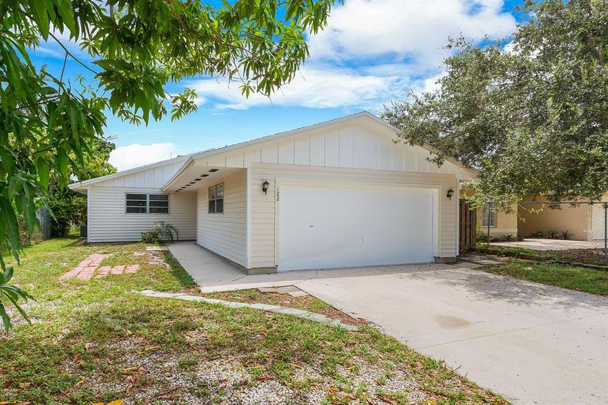Priced to sell!! 3 bedrooms, 2 full bathrooms, 2 car garage single family home close to downtown Delray.  Private fenced yard, large living room with fireplace, open kitchen, new laminate wood floors in living room, new tile in kitchen, new carpet in bedrooms, and fresh interior paint.