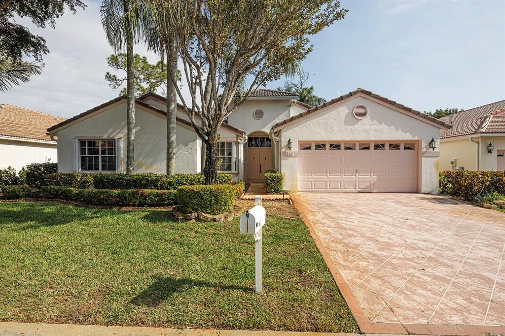 Photo of 113 Egret Circle Cir, Greenacres, FL 33413 (MLS # R10702153)