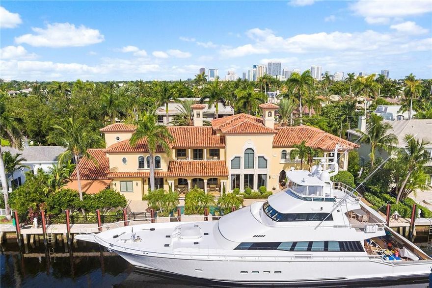 Located on one of the finest South Las Olas Isles & close to the point. This substantial & luxurious deep water residence has 150 ft of waterfront with dockage set-up to accommodate upto 130 ft yacht with easy access to the Port. Incredibly well built & detailed with amazing craftmanship - originally custom builder's own residence! Fabulous living & family room, Chef's kitchen, bar, wine cellar & entertaining areas.  Potential for substantial VIP Guest Suite & Staff/Captain Quarters on ground floor. The rooms are well proportioned throughout including Bedroom Suites & an amazing expansive Master Wing with two separate bathrooms. Many rooms open to covered loggias & balconies for outdoor enjoyment. Move in ready & available to close quickly - now offered below replacement value.