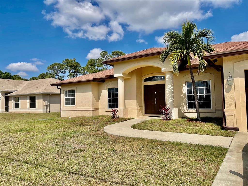 Photo of 1725 SW Penrose Avenue, Port St Lucie, FL 34953 (MLS # R10869210)