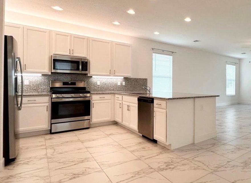 *** Price Reduction *** ABSOLUTELY GORGEOUS! Very desirable and rare Tribeca Model in Valencia Grove at Riverland, with water view, 4bed/2.5 ba, 2 car garage and an oversized screened enclosed patio overlooking the water. Lovely open floor plan, spacious master suite with his/hers closet, upgraded tile throughout the home, gas stainless steel appliances. This home has everything you dreamed of, a resort style Clubhouse, stunning social hall with raised stage where you will find live entertainment and events, several pools, tennis and pickleball courts, restaurant, great fitness center, multiple card rooms, catering kitchen for cooking, horticulture, demonstrations and a room for arts and crafts.New cabinets in laundry and new attic access ladder