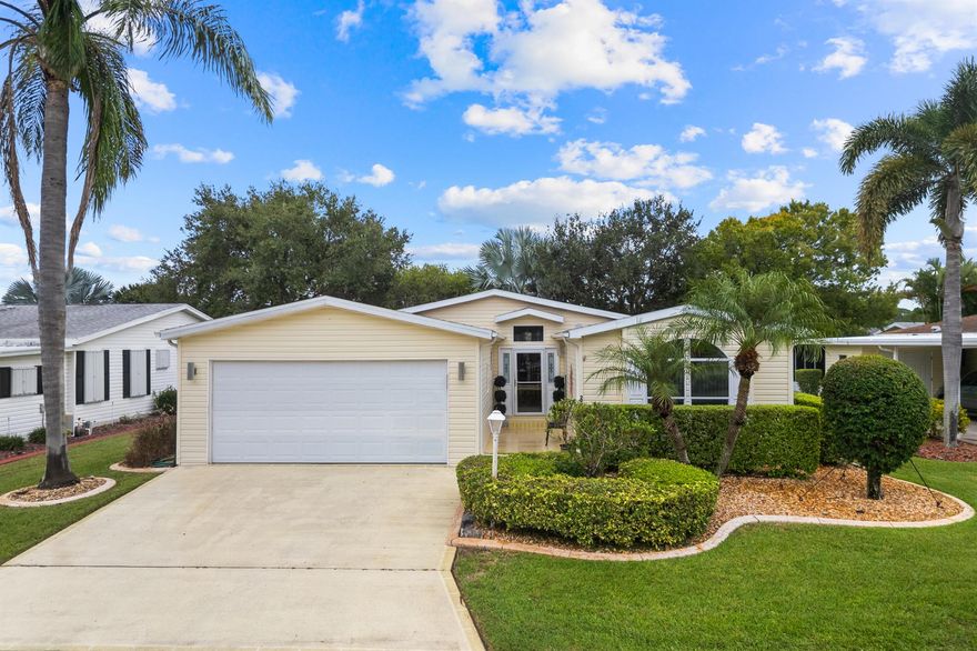 This charming split floor plan home is a keeper!  Perfect open concept floor plan is perfect for entertaining.  Huge extensive lanai along with a mini split AC unit.  This home comes furnished.  Roof & AC 2021 as well as HWH 2023.  THIS HOME IS ON LEASED LAND.