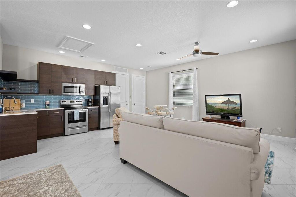 Photo of 5013 Grandiflora Road, Palm Beach Gardens, FL 33418 (MLS # B26001477)