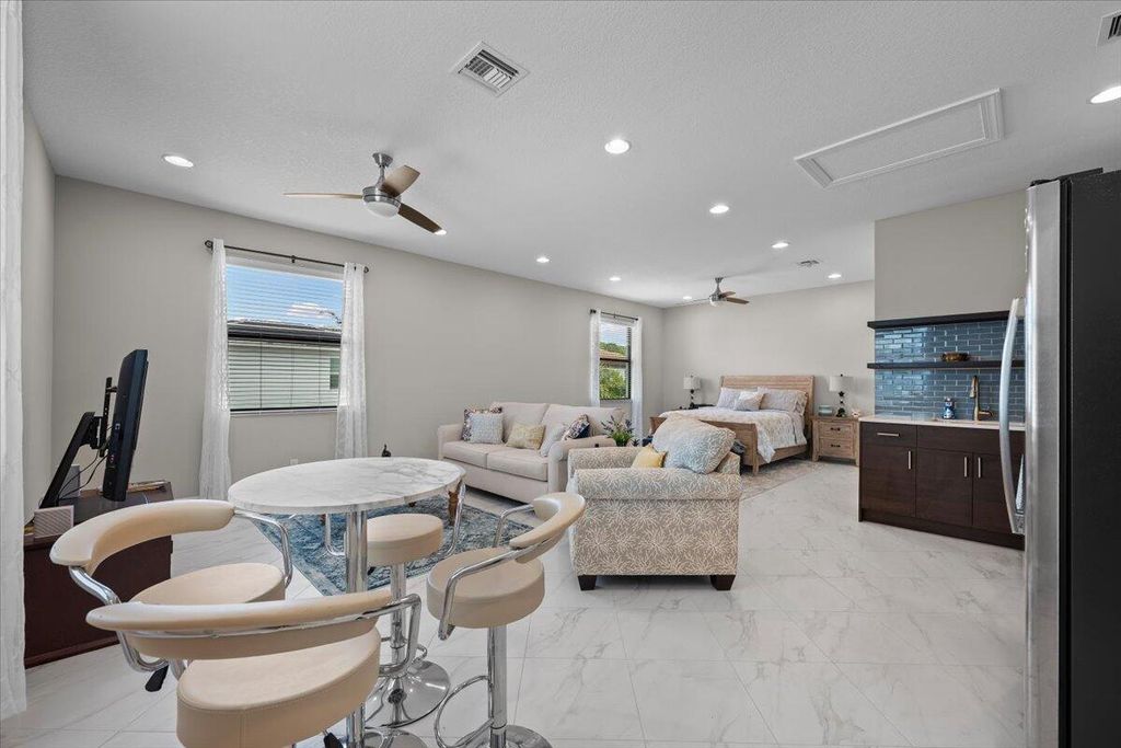 Photo of 5013 Grandiflora Road, Palm Beach Gardens, FL 33418 (MLS # B26001477)