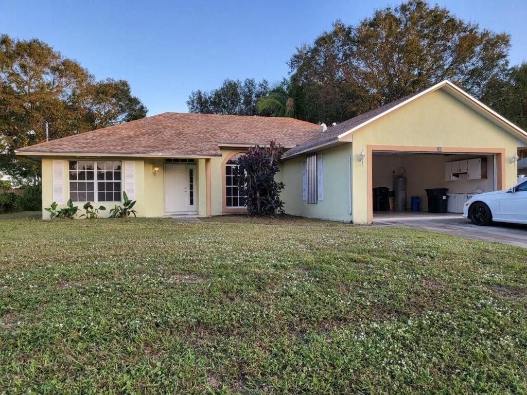 Photo of 709 SW Aster Road, Port Saint Lucie, FL 34953 (MLS # R11066355)