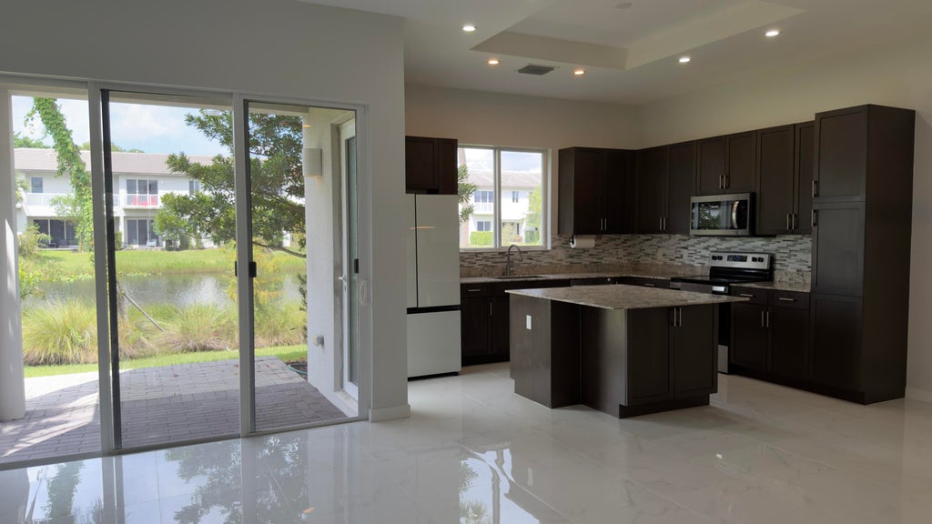Photo of 761 PIONEER Way, Royal Palm Beach, FL 33411 (MLS # B26079504)