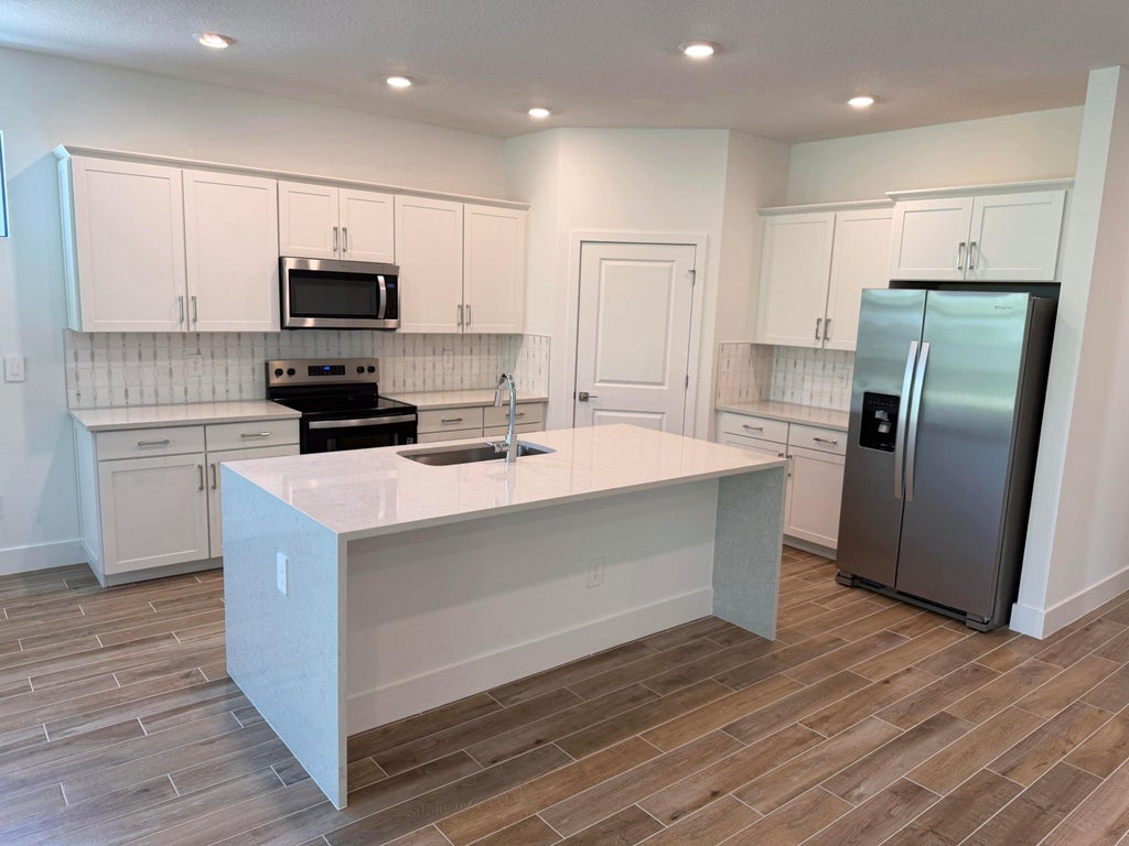 Photo of 6551 SE Park Trace Drive, Stuart, FL 34997 (MLS # B26076334)
