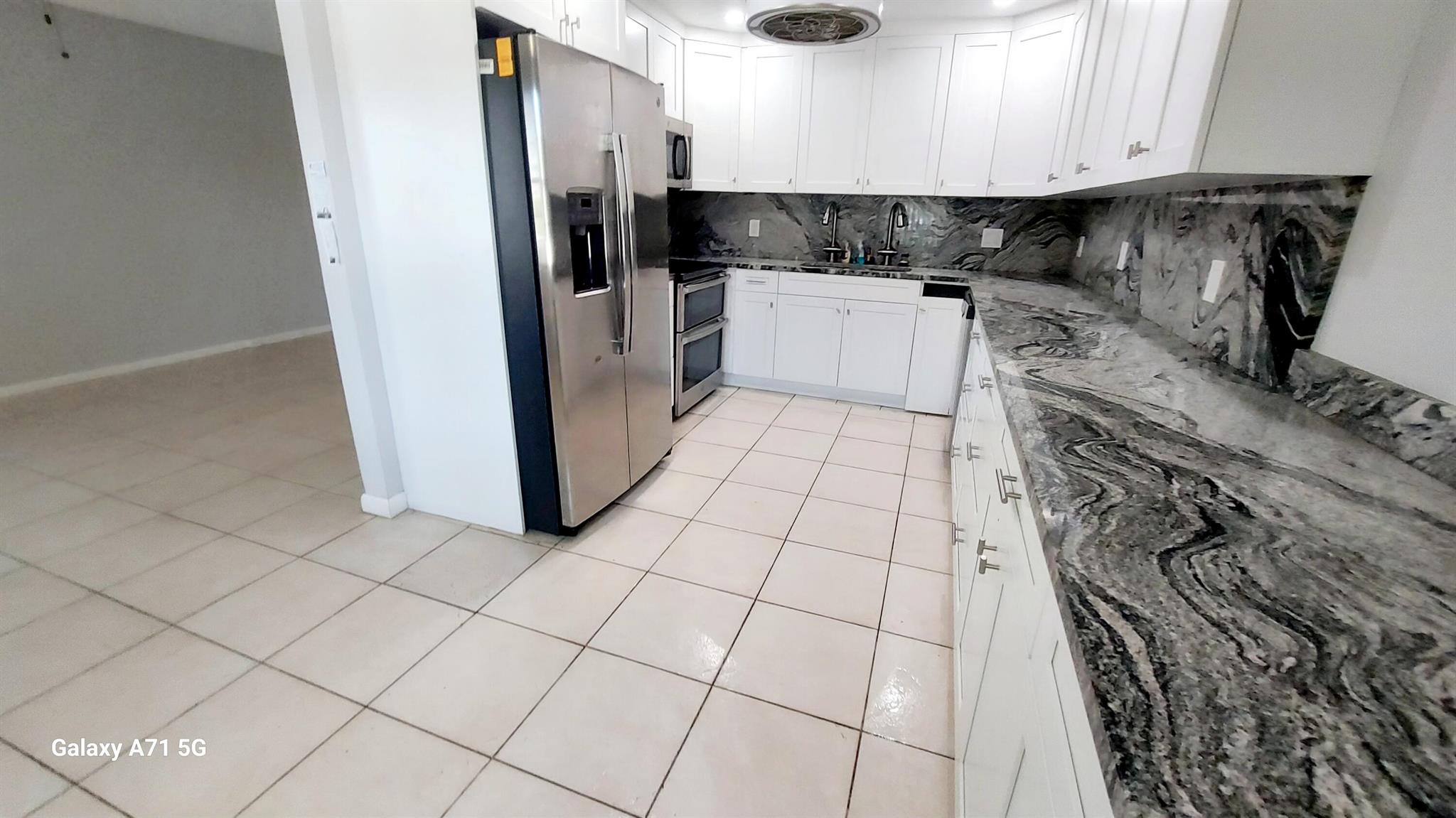 RENOVATED Kitchen! In 55 plus community with FIRST FLOOR WATERVIEW! Sparkling! Hurricane proof windows and doors in rear Lani which creates another room. Beautifully RENOVATED kitchen with granite cabinets extended into dining area for countertops and backsplash, with the increased cabinet space creating a larger kitchen look! MODERN WHITE kitchen! Stainless-steel appliances! Double sink! This 2-bedroom 2 bath has a very spacious feeling. Bathrooms with new vanity and modern toilet. Recessed lighting in kitchen. This condo is unfurnished