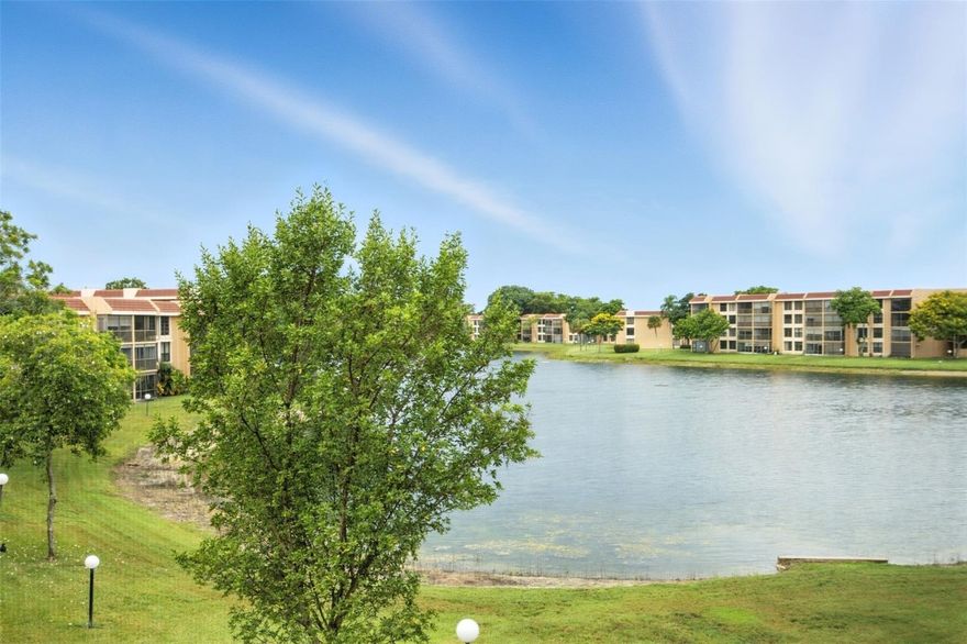 Spacious and priced to move! This 2-bedroom, 2-bath corner unit offers tranquil lake views and a functional layout with large bedrooms. With 1,090 square feet of living space, the residence features an in-unit washer and dryer, ample storage, and a screened-in patio perfect for enjoying peaceful sunsets & lake fountain. Located in a well-maintained 55+ community, residents enjoy access to a clubhouse, pool, and billiards room, all just minutes from shopping, dining, and major conveniences. Association has ample reserves and no planned assessments. All occupants must have a 650+ credit score. No leasing permitted during the first two years of​​‌​​​​‌​‌​​​‌‌​​​‌‌‌​​‌​​‌‌​​​​ ownership.