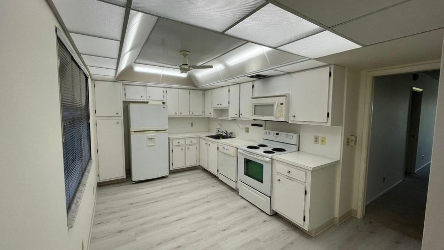 Don't miss out on this rare find! The F Unit in Palm Aire offers 3 bedrooms, 2.5 baths, and even a washer dryer—hard to come by in this area. With spacious rooms and a huge family room that opens to a screened balcony, you'll enjoy stunning views of lakes, rivers, and greenery. Unit has been refreshed with updated master bath and brand new carpeting in bedrooms and living room with new vinyl flooring in the kitchen and entryway. Home was also freshly painted. Priced just right, this gem won't last long. Schedule your private tour now!