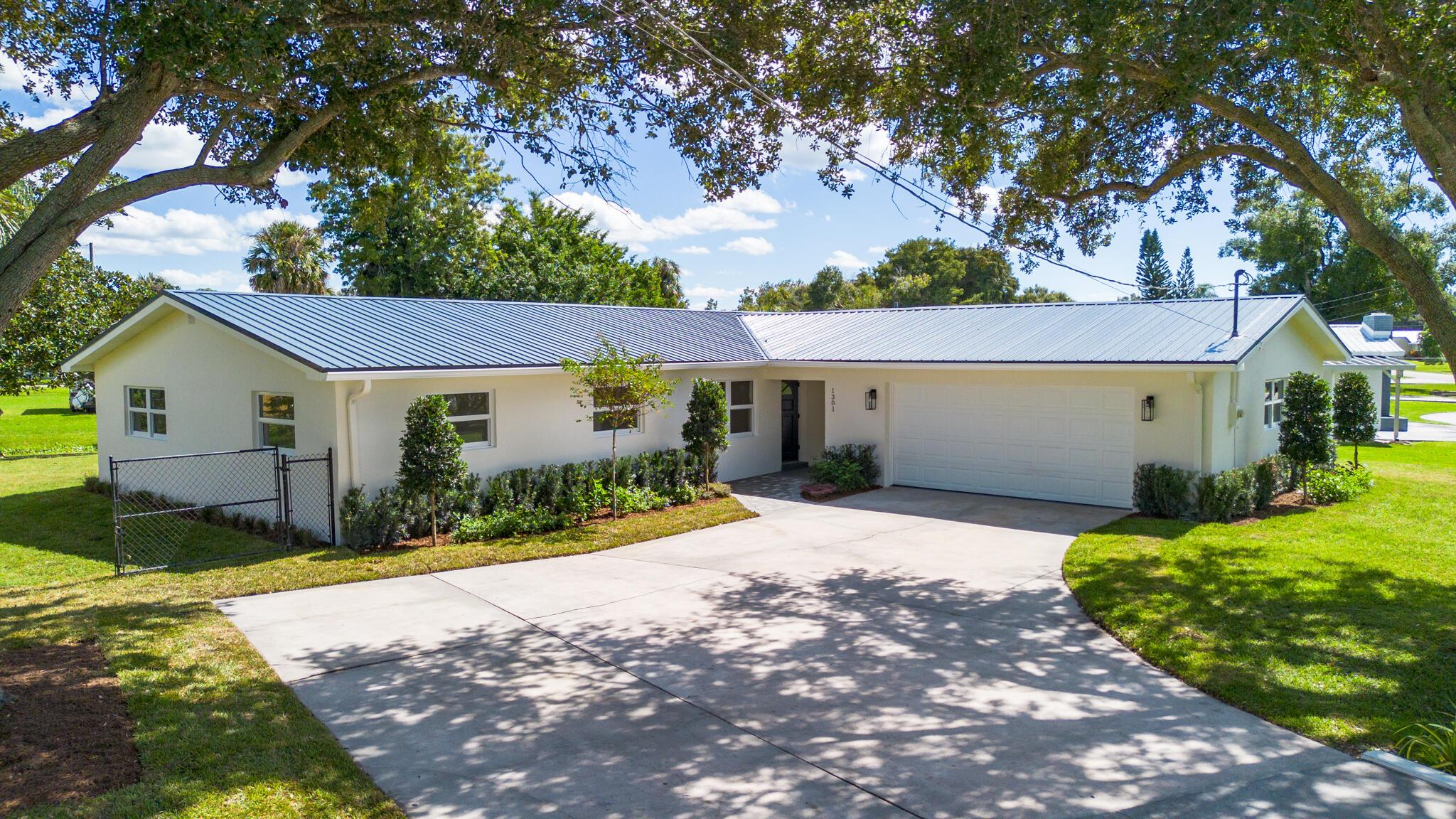 Experience the best of Florida living in this exceptional waterfront home just minutes from Lake Okeechobee. Enjoy canal frontage with direct lake access, perfect for boating, fishing, or peaceful waterfront relaxation.Thoughtfully updated for modern comfort and style, it features a new roof, impact windows, and more for complete peace of mind. Inside, you'll find a beautifully designed kitchen and bathrooms, a split floor plan for privacy, and two spacious living areas ideal for entertaining. Outside, enjoy a fully fenced backyard, perfect for kids, pets, or relaxing evenings by the water.Don't miss your chance to own this move-in-ready home where comfort, convenience, and Florida living meet!