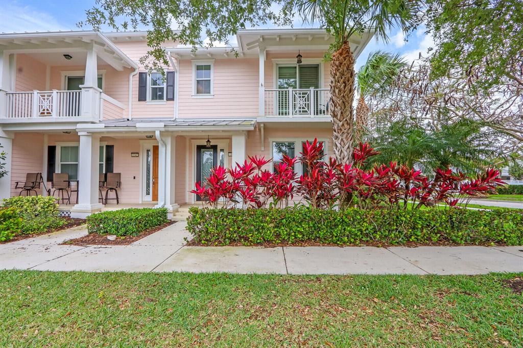 Prepare to be swept off your feet by this stunning turnkey townhouse nestled in the heart of Mallory Creek at Abacoa. As soon as you step inside, you'll be amazed by how impeccably clean and updated this corner unit is. Boasting 3 bedrooms and 2.5 baths, this townhouse has been fully furnished with a coastal vibe and stocked with everything a tenant could possibly need. And with impact glass and doors, you can rest easy knowing that you're safe and secure. Get ready to be wowed by the tasteful updates throughout this townhouse. From the diagonal set tile floors in the downstairs living space to the new hardwood floors upstairs, this townhouse is the epitome of the perfect rental. And with a brand new A/C from 2020 and a new hot water heater, you'll be living in pure comfort.