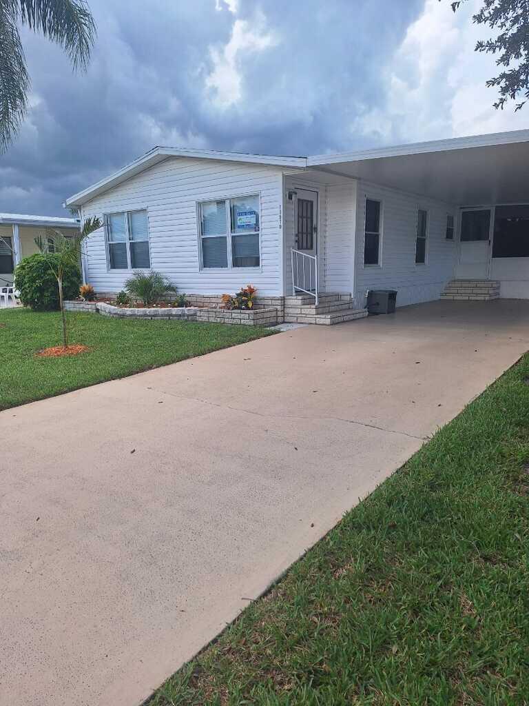 Motivated Seller- Bring All Offers! Move-in Ready HomeThe seller is currently building another home and is motivated to sell quickly. This bright and cheerful 2-bedroom, 2-bath home is nestled in the desirable 55+ community of Spanish Lakes Fairways in Fort Pierce, Step inside to find a spacious open concept living and dining area filled with natural light. The kitchen is clean and functional, featuring plenty of cabinet space, updated appliances, and a breakfast bar that opens to the living area -- perfect for entertaining. Both bedrooms are generously sized, with the primary suite offering an en-suite bath and ample closet space. Laminate flooring runs throughout the main areas for a clean, low-maintenance lifestyle.