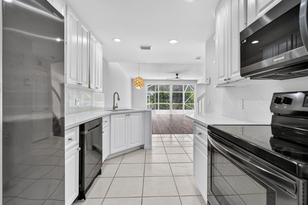Photo of 112 Santa Barbara Way, Palm Beach Gardens, FL 33410 (MLS # B26045181)