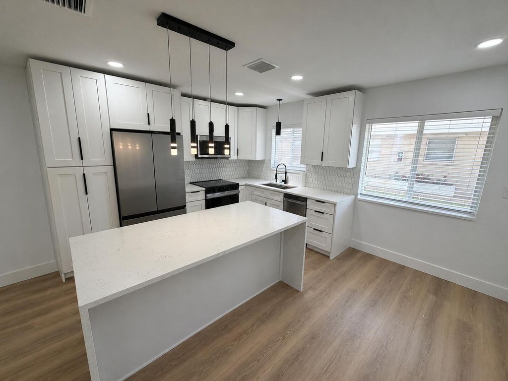 Photo of 1077 NE 34th Street #1, Oakland Park, FL 33334 (MLS # B26020778)