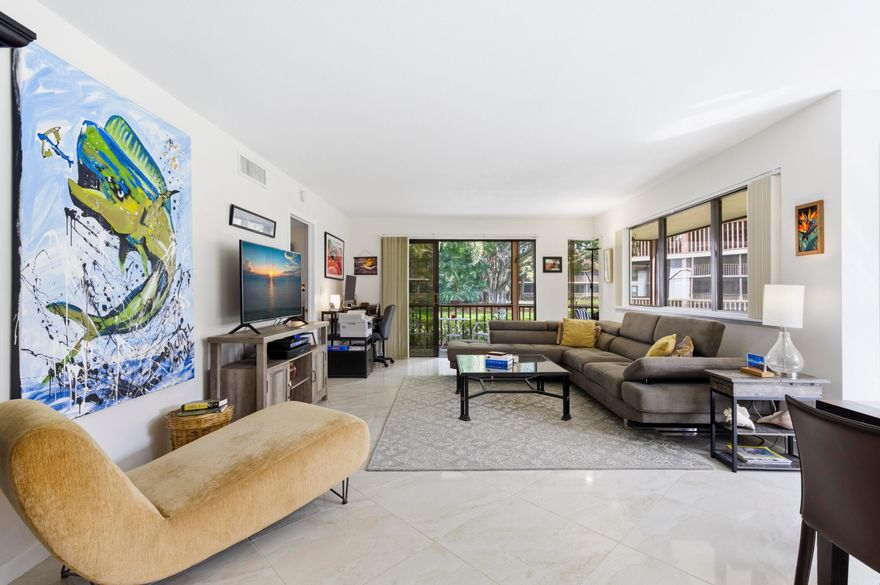 Beautiful first-floor end-unit Golf villa in the sought-after PGA National. Immaculate 2-bedroom, 2-bath corner condo offers a light, bright open layout. Enjoy peaceful mornings & relaxing evenings from your private wraparound screened balcony, perfect for indoor-outdoor living. Includes a beautifully renovated primary bath, elegant tile flooring, and new bedroom carpeting. The spacious design & abundant natural light create a comfortable, resort-style atmosphere ideal for everyday living or entertaining. Perfect as a full-time residence, seasonal retreat, or investment property. Located in one of Palm Beach County's premier golf communities, just minutes to dining, shopping, world-class golf, beaches, and only 15 minutes to WPB Airport. Beautiful home, Perfect location, Terrific Value!