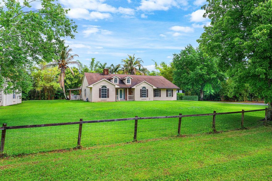 Set on a beautifully manicured and fenced 1.15-acre lot, this home offers the kind of privacy, space, and versatility that is getting harder to find. This updated 4-bedroom, 2-bath pool home blends modern upgrades with a peaceful, tucked-away setting that feels like your own private retreat. Inside, the home has been thoughtfully renovated and is move-in ready, with a fresh, updated feel throughout. A newer roof and A/C add even more value and peace of mind. Outside, the property truly stands out with two separate driveways off the paved private road, a huge detached garage with double-height ceilings with plenty of access and room for boats, trailers, toys, or work vehicles - no HOA!  Rare opportunity to own a fully updated acreage property with a pool, privacy, and a massive garage! Location, Location, Location!  Adding to this property's appeal is its prime location near the rapidly growing Avenir master-planned community down the street. As Avenir continues to expand, nearby residents are expected to benefit from increased convenience and access to new shopping, restaurants, grocery options, and everyday services coming to the corridor. Avenir's Town Center is under construction and is slated to bring a Publix plus nearly 20 shops, restaurants, and service businesses, with openings tied to summer 2026. The broader area is also seeing more retail growth nearby, including an Aldi, Starbucks, and additional commercial development at Coconut Crossing. This ongoing growth will continue to enhance the lifestyle appeal and long-term desirability of this location.