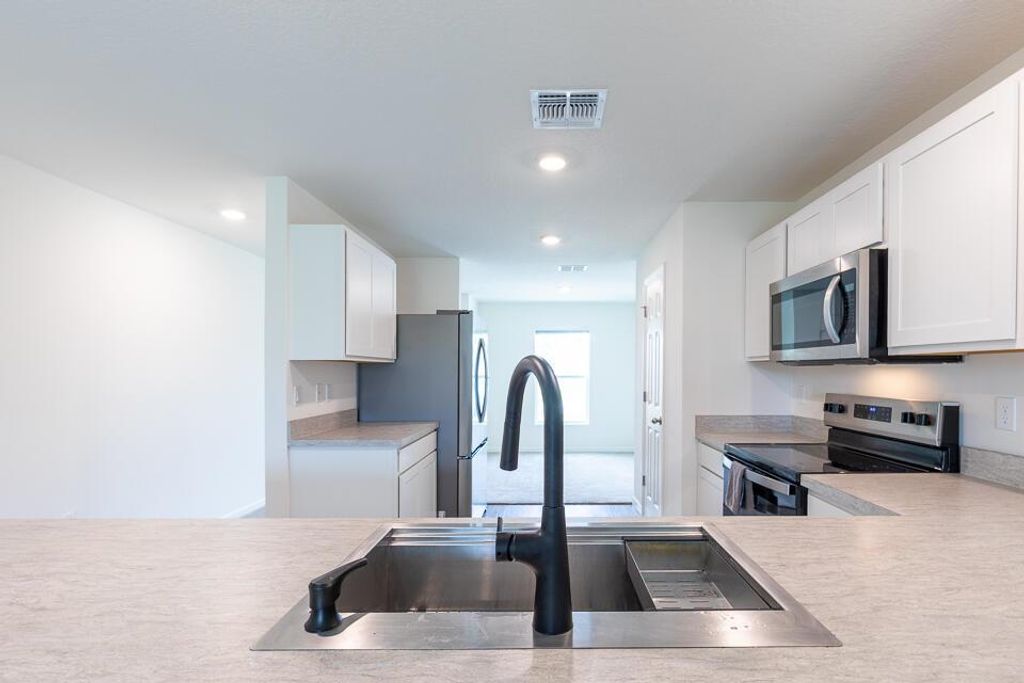 Photo of 1042 SW California Boulevard, Port Saint Lucie, FL 34953 (MLS # R11098979)