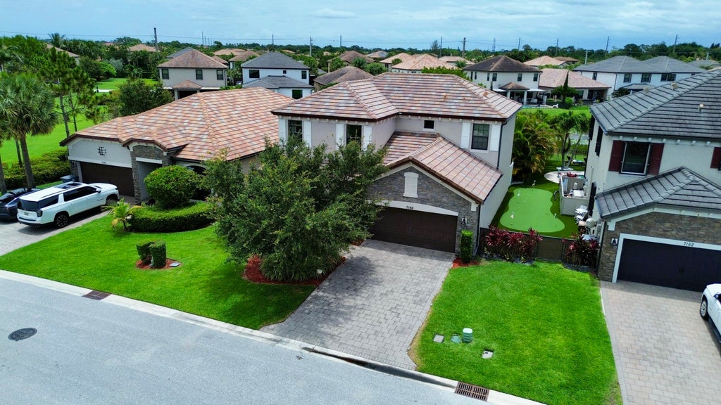 Photo of 7146 Sandgrace Lane, Greenacres, FL 33463 (MLS # B26038694)