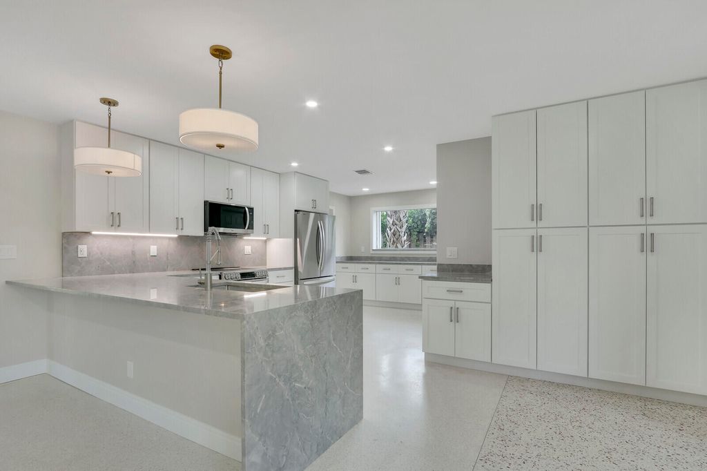 Photo of 732 Pelican Way, North Palm Beach, FL 33408 (MLS # B26026639)
