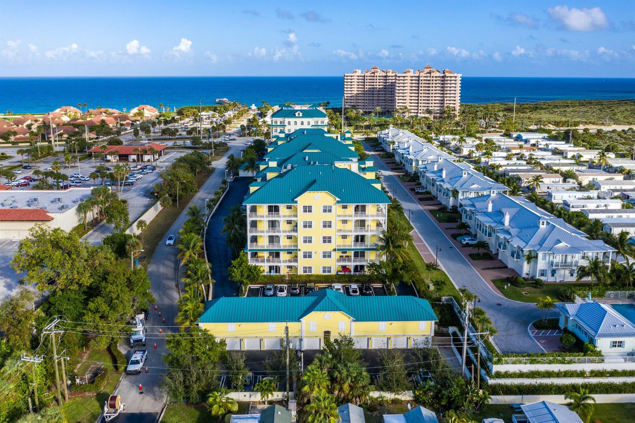 Discover your perfect escape in this stunning 4th floor corner condo! This professionally designed 2-bedroom, 2.5-bath unit with den offers over 2,000 square feet of beautifully furnished living space. The corner location provides amazing ocean breezes and partial ocean views from your huge wrap-around balcony - perfect for morning coffee and sunset cocktails. Step off the elevator into your private foyer, then enjoy the open floor plan with granite countertops, white cabinets, and crown molding throughout. The kitchen features a large pantry, while high-impact glass and sliders maximize natural light. Your detached garage and in-unit washer/dryer add convenience. Overlook the pool and nature preserves while being steps from shopping and dining. Ready to make memories?