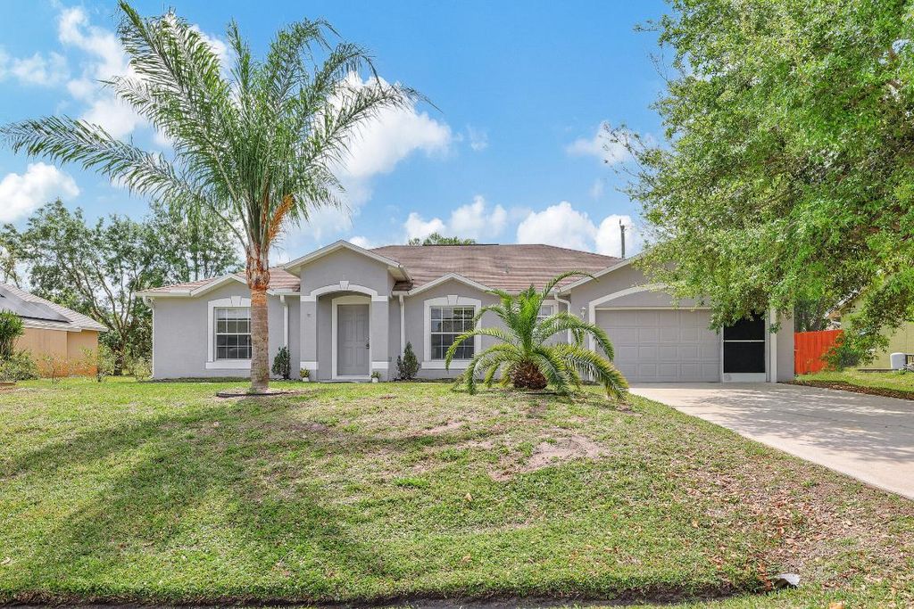 Photo of 1226 SW Calmar Avenue, Port Saint Lucie, FL 34953 (MLS # R10966582)