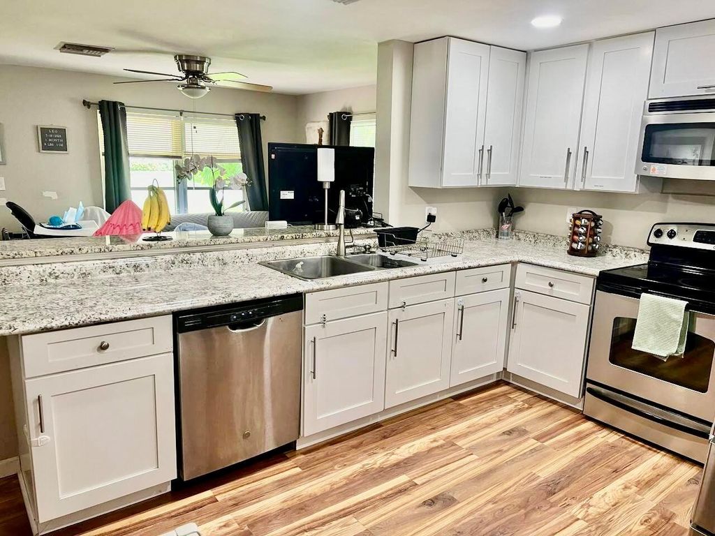 Photo of 609 NW 7th Court, Boynton Beach, FL 33426 (MLS # R11011908)