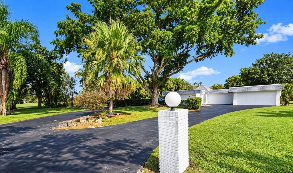 Photo of 5707 WHITE HICKORY Circle, Tamarac, FL 33319 (MLS # B26085400)