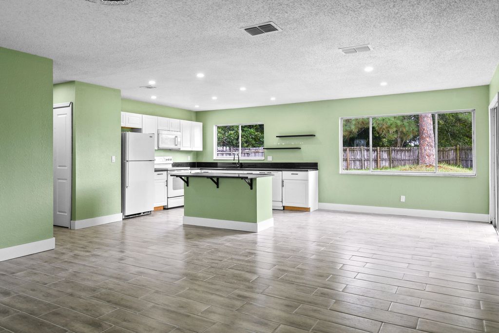 Photo of 2079 SE Triumph Road, Port Saint Lucie, FL 34952 (MLS # R11139253)