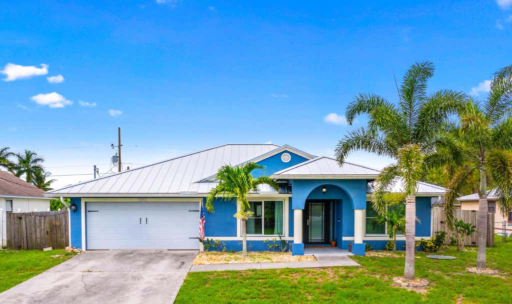 Photo of 1042 SW Dubuque Avenue, Port Saint Lucie, FL 34953 (MLS # R11000661)