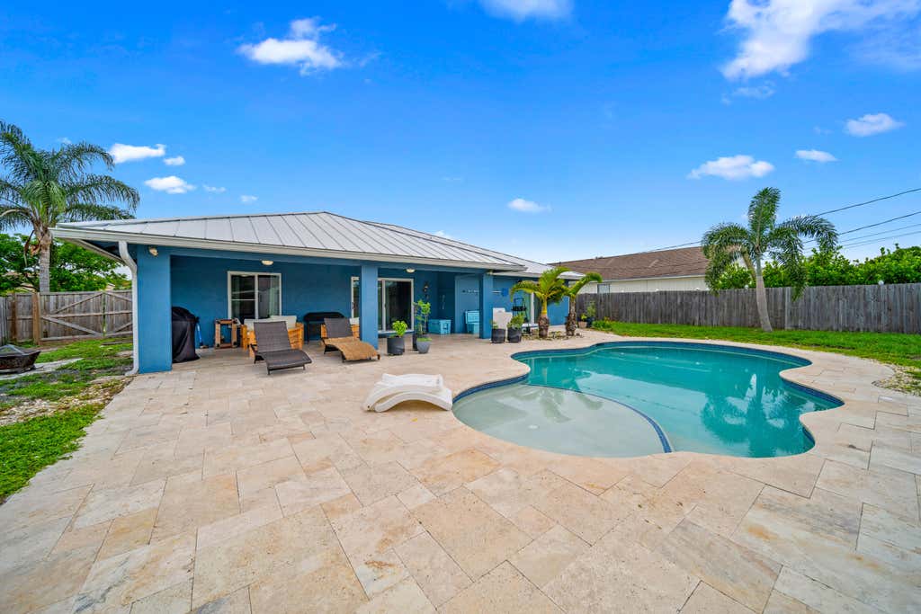 Photo of 1042 SW Dubuque Avenue, Port Saint Lucie, FL 34953 (MLS # R11000661)