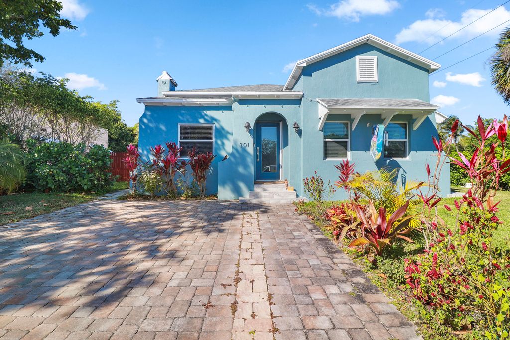 Photo of 301 Hawthorne Drive, Lake Park, FL 33403 (MLS # B26005661)