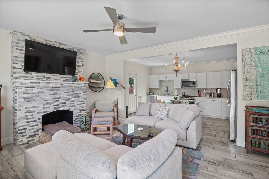 Photo of 301 Hawthorne Drive, Lake Park, FL 33403 (MLS # B26005661)