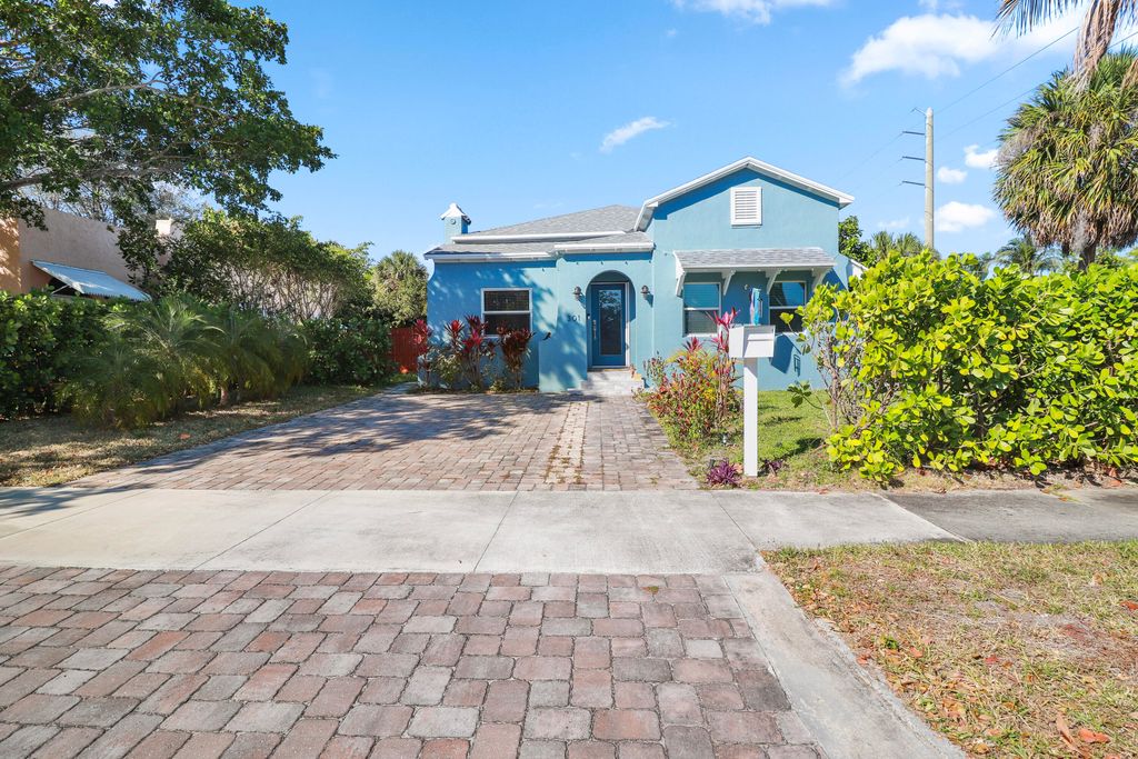 Photo of 301 Hawthorne Drive, Lake Park, FL 33403 (MLS # B26005661)