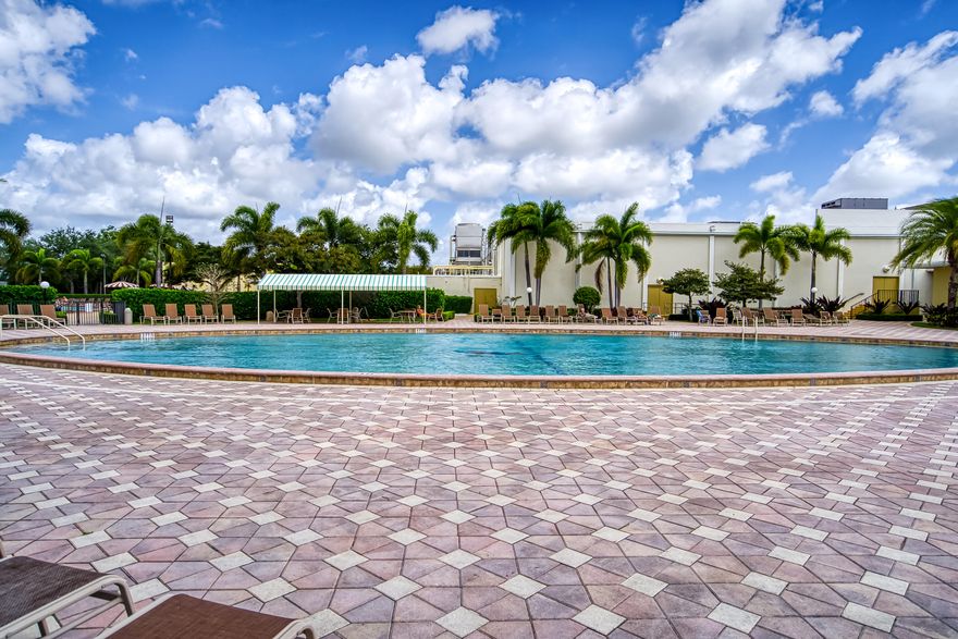 Welcome to the good life at Golf's Edge, a charming residence nestled within the renowned Century Village, one of South Florida's most celebrated 55+ gated communities in West Palm Beach. This bright and inviting 2-bedroom, 2 bath corner unit offers serene garden views and an abundance of natural light, the perfect setting to enjoy a relaxed Florida lifestyle. Water is included in the monthly maintenance, adding ease and value to everyday living. Golf's Edge also features its own private heated swimming pool, exclusively for its residents. As part of Century Village, you'll enjoy an exceptional array of resort-style amenities. At the heart of the community sits a magnificent 2-acre clubhouse with a 1,221-seat theater hosting live entertainment throughout the year, along with a fitness