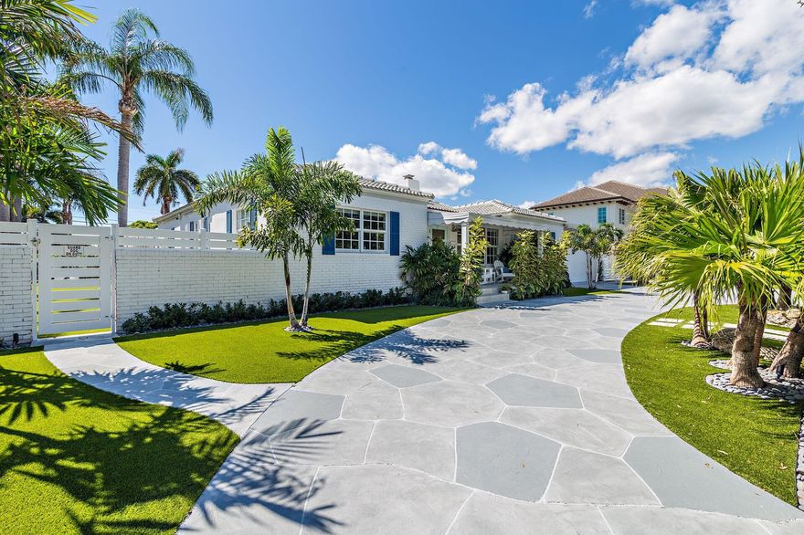 Recently renovated and opened up, this split floor plan one-story home features 4 bedrooms with 4 full bathrooms and a private office overlooking the enormous (turfed) backyard. Featuring high ceilings, a newly renovated kitchen and master bathroom, this property is fully turfed and fenced in with electric front gates and a separate back alley entrance/ driveway. Hosting ample room for a guest house addition &/or a 4+ car garage, one can add on/ reimagine or live here AS-IS.  The pool was redone in 2021 and the home does have impact rated glass. Located east of Olive Ave, North of Forest Hill, South of Southern Blvd and in the South Olive Elementary school district.  Close to area beaches, I-95, Flagler Drive bike bath, Worth Avenue shopping and fabulous dining.