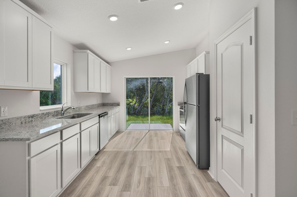 Photo of 5717 Palm Drive, Fort Pierce, FL 34982 (MLS # B26013931)