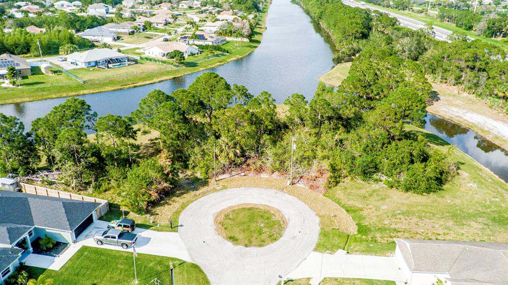 This .46 acre with .31-acre developable lot in Port St. Lucie is an outdoor enthusiast's dream come true! With beautiful views of the canal, this is perfect for outdoor activities like fishing, canoeing, and bird watching. There is ample room to build whatever structure you choose. This lot is tucked away in its own corner, surrounded by nature, yet close to all the necessities of city living. With its amazing views, this would make an ideal site for a piece of paradise.